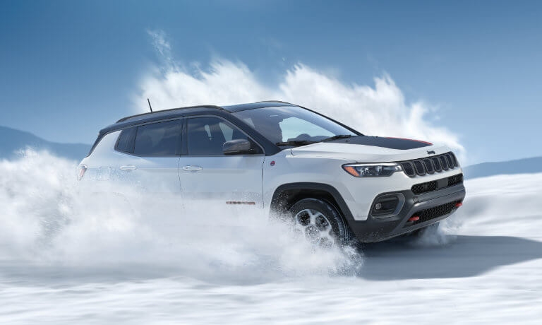 2026 Jeep Compass driving through snow