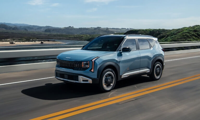 2027 Kia Seltos driving fast on highway