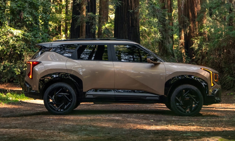 2027 Kia Seltos side view in forest