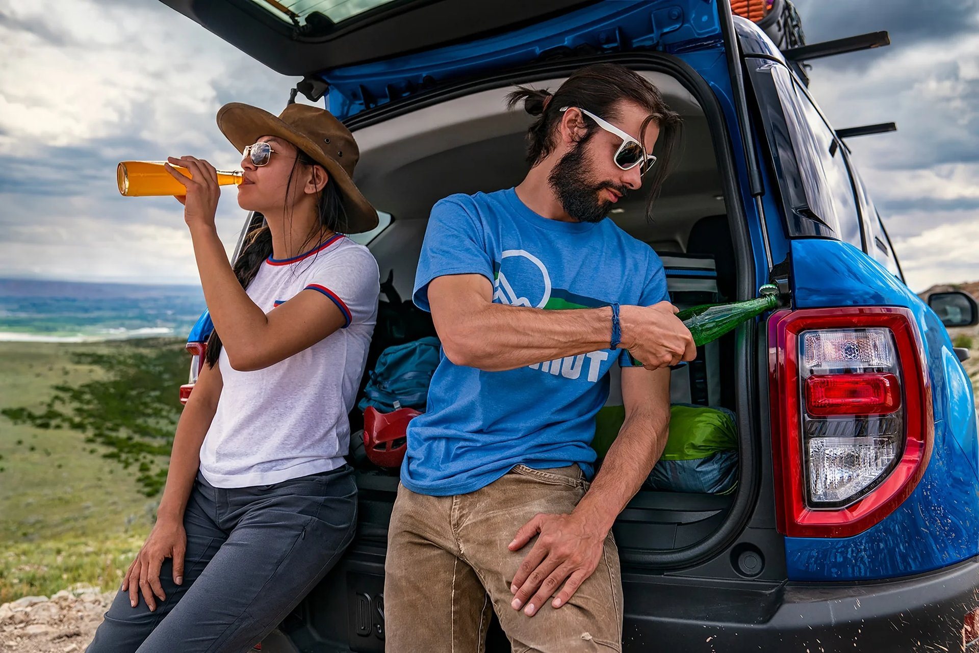 Two people at the open liftgate of a 2026 Ford Bronco Sport