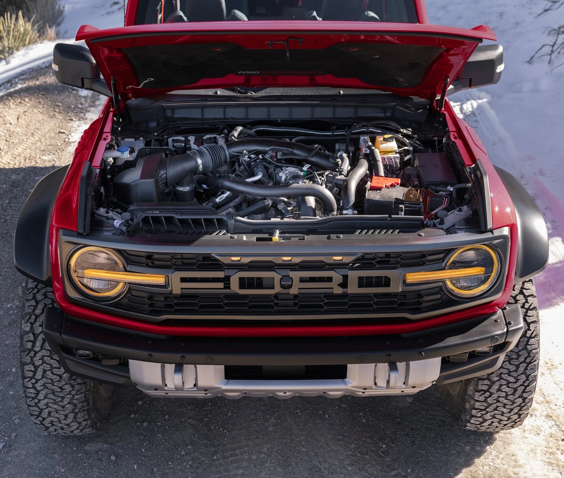 2026 Ford Bronco Raptor with the hood up showing the 3.0L EcoBoost V6