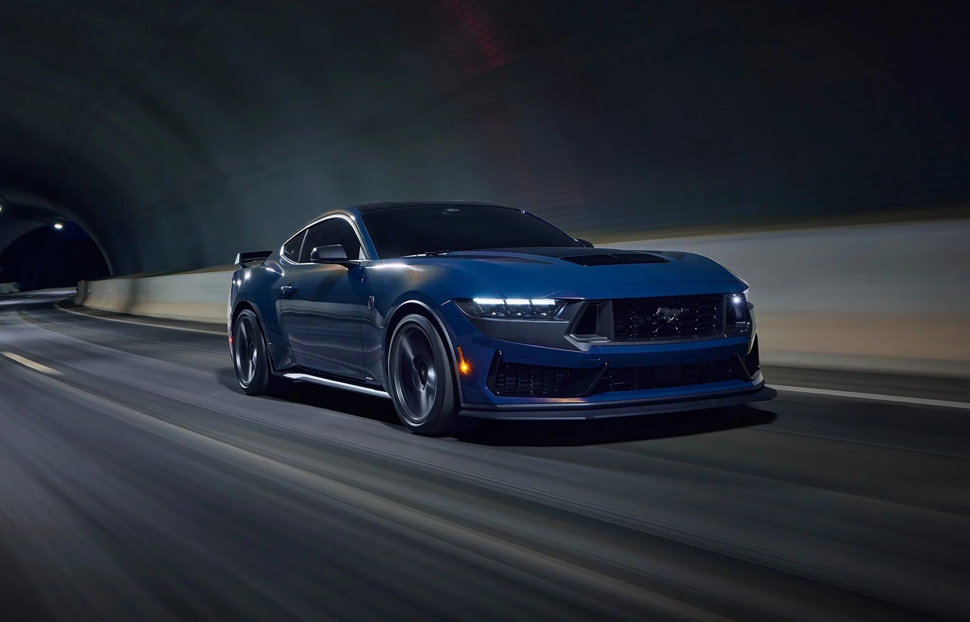 Current Ford Mustang Dark Horse driving through a tunnel