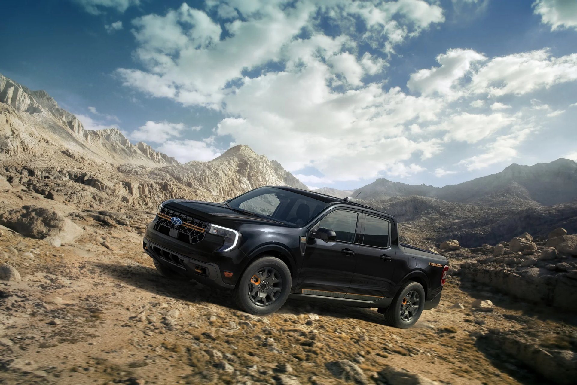 2026 Ford Maverick Tremor driving up a rocky hillside