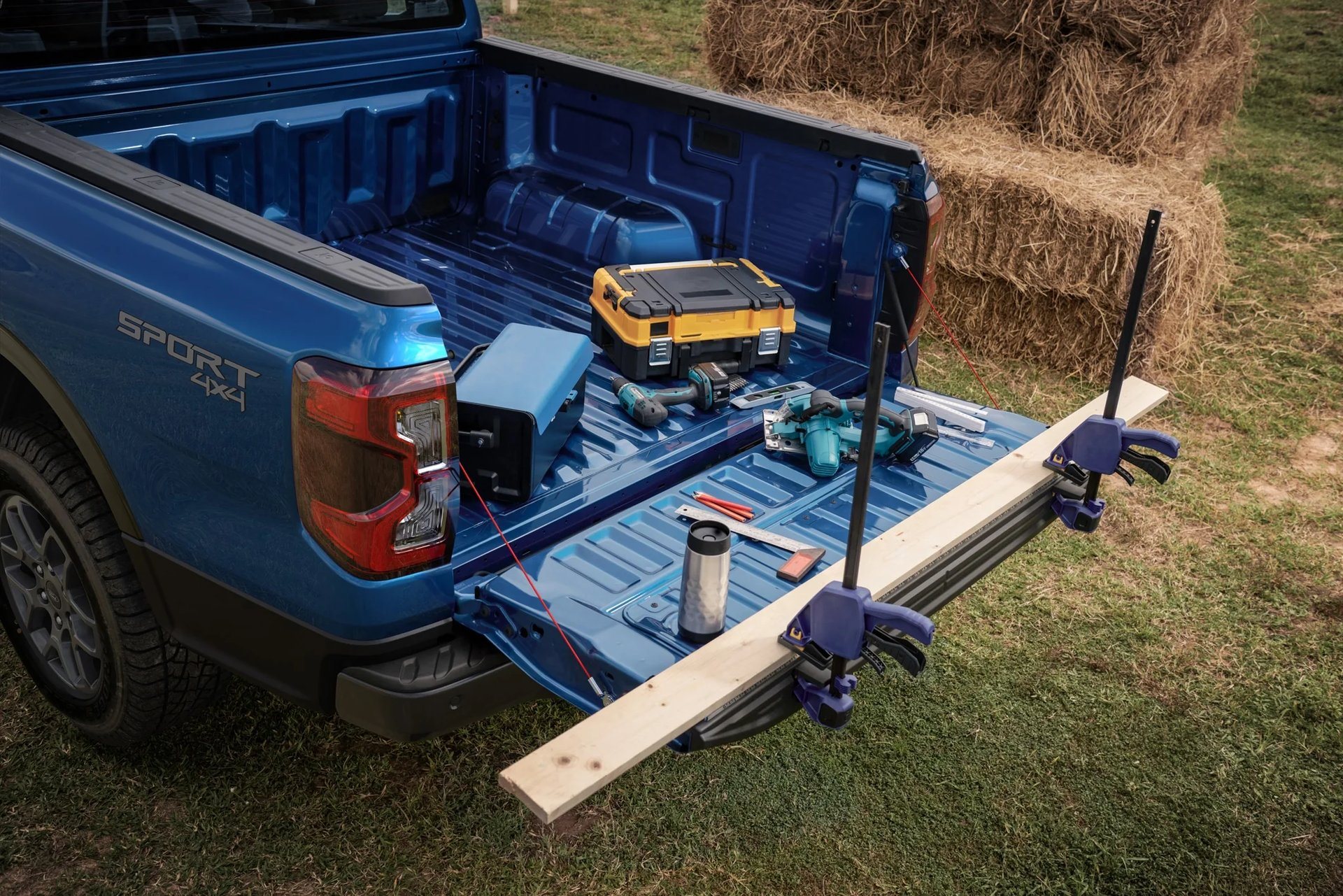2026 Ford Ranger with the tailgate open and lumber loaded in the 5-foot bed