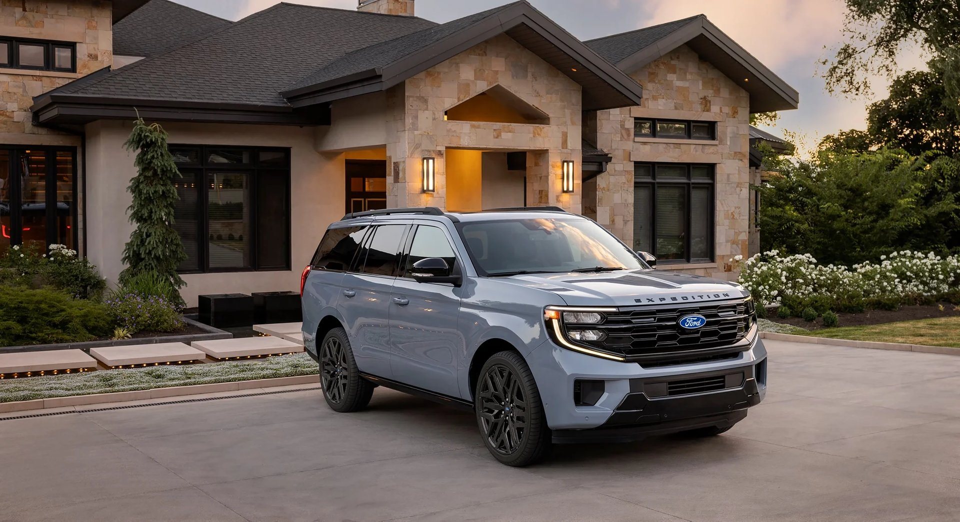 Ford Expedition parked in front of a house, a full-size three-row SUV at Jenkins and Wynne Ford