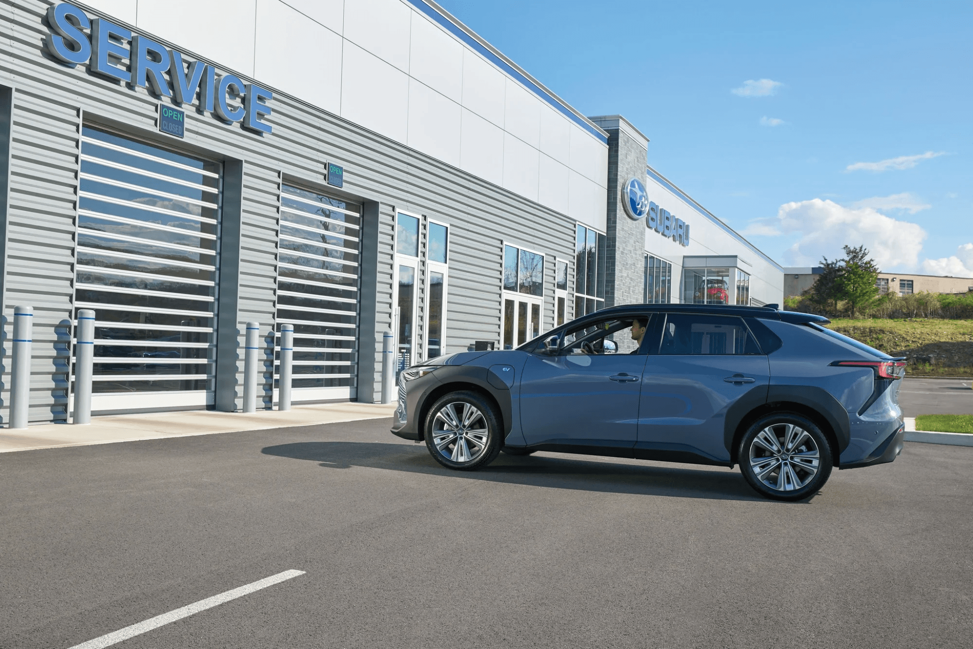 A Subaru-trained technician performing a multi-point inspection in the service bay at Findlay Subaru Prescott.