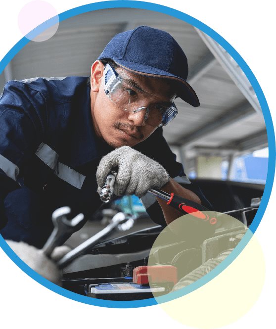 Image of a person fixing an engine