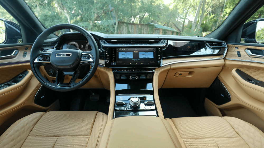 2026 Jeep Grand Cherokee interior in Margate FL with tan leather seats and McIntosh touchscreen