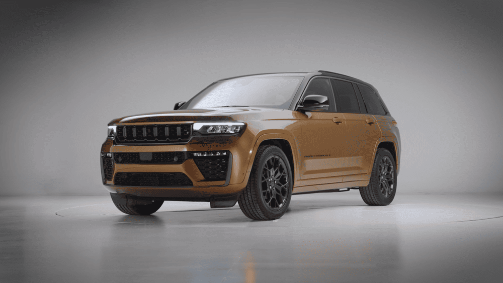 2026 Jeep Grand Cherokee in Margate FL in bronze with black alloy wheels on studio background