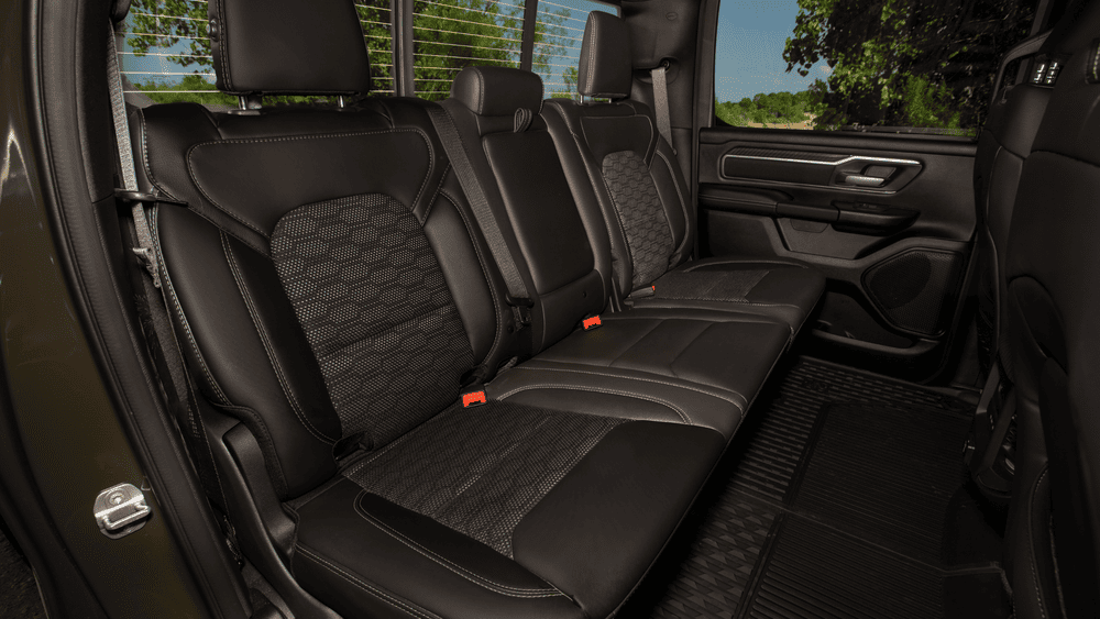 2026 Ram 1500 rear crew cab seating in Margate FL with black leather seats and mesh fabric inserts