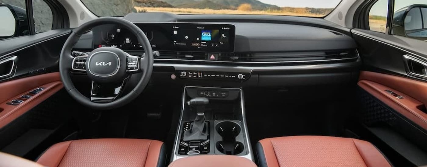 Black and brown dash in a 2026 Kia Carnival.
