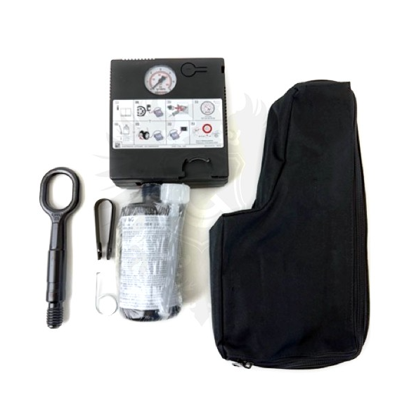 Volkswagen Tire Mobility Kit with sealant bottle, hose and 12-volt compressor laid out beside an open hatch