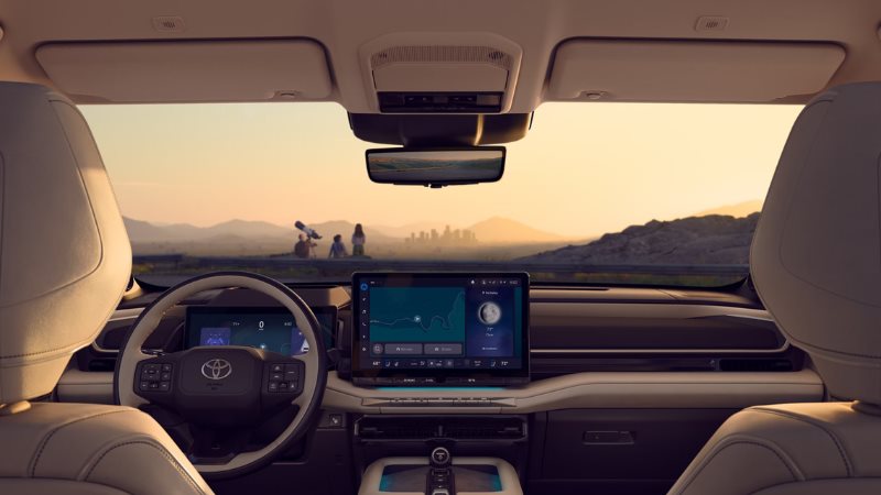 Interior of the all-electric 2027 Toyota Highlander showing the 14-inch touchscreen