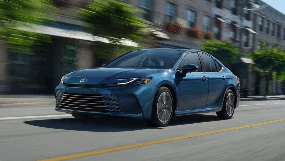 2026 Toyota Camry driving through a city street