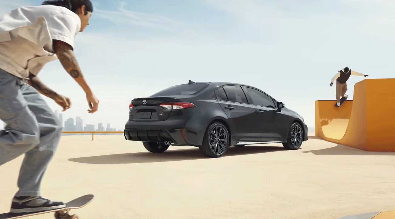 2026 Toyota Corolla Hybrid rear view at a skate park