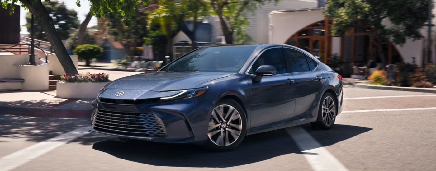 A gray 2026 Toyota Camry XLE turning a corner.