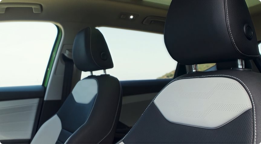 Black and light grey leather front seats in the 2027 Volkswagen Taos