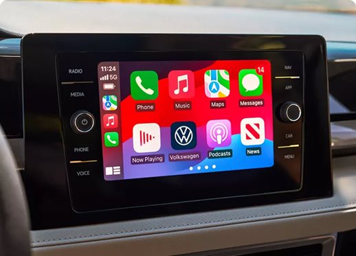 8-inch touchscreen showing the Apple CarPlay home screen in the Volkswagen Taos