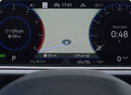 VW Digital Cockpit instrument cluster showing the time, trip data and a navigation map