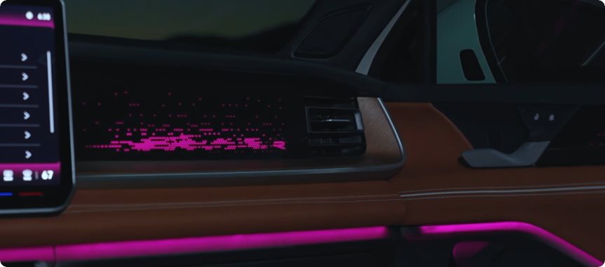Magenta ambient lighting across the Volkswagen Tiguan dashboard and door trim