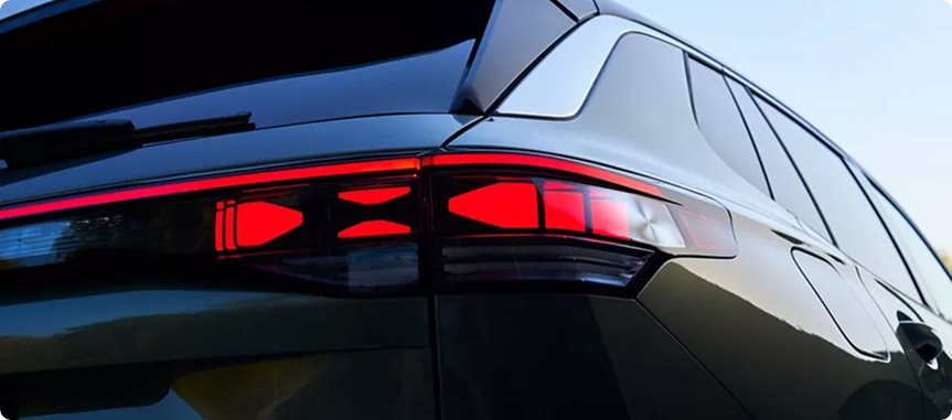 LED taillights and rear light bar lit on a dark Volkswagen Tiguan