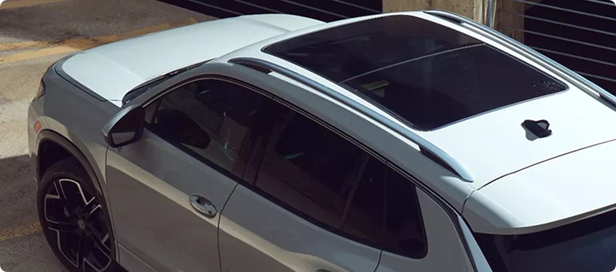 Overhead view of a white Volkswagen Tiguan roof with the panoramic sunroof