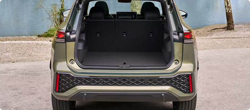 Open liftgate on a green Volkswagen Tiguan showing the cargo area