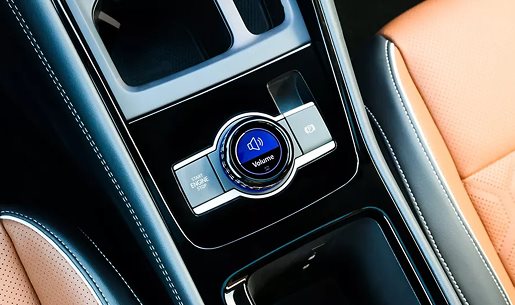 Driving Experience Dial in the center console between cognac leather seats