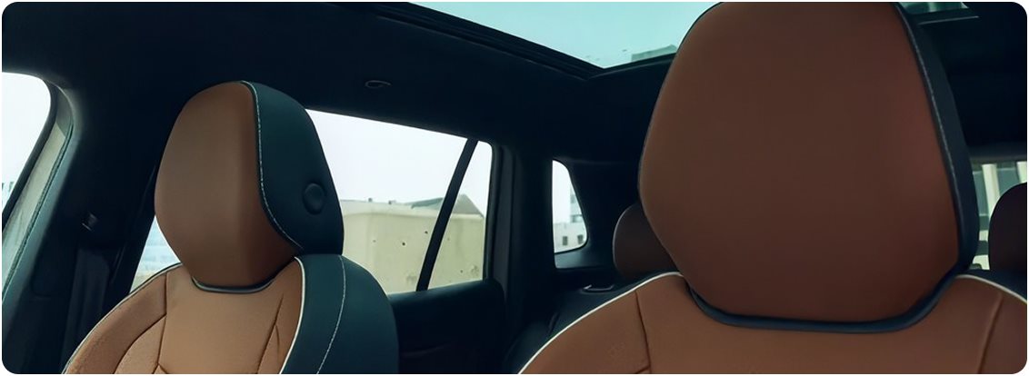 Cognac leather front seats under the panoramic sunroof of the Volkswagen Tiguan
