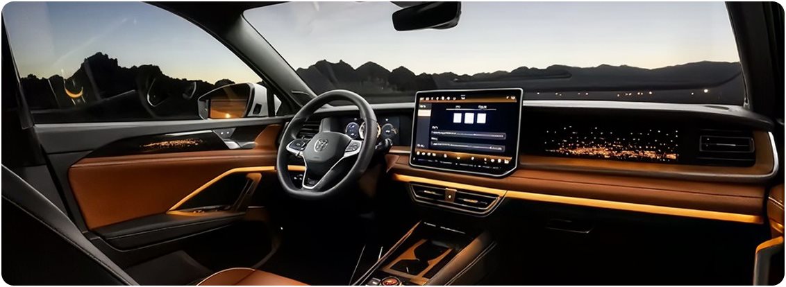 Volkswagen Tiguan dashboard lit by amber ambient lighting at dusk