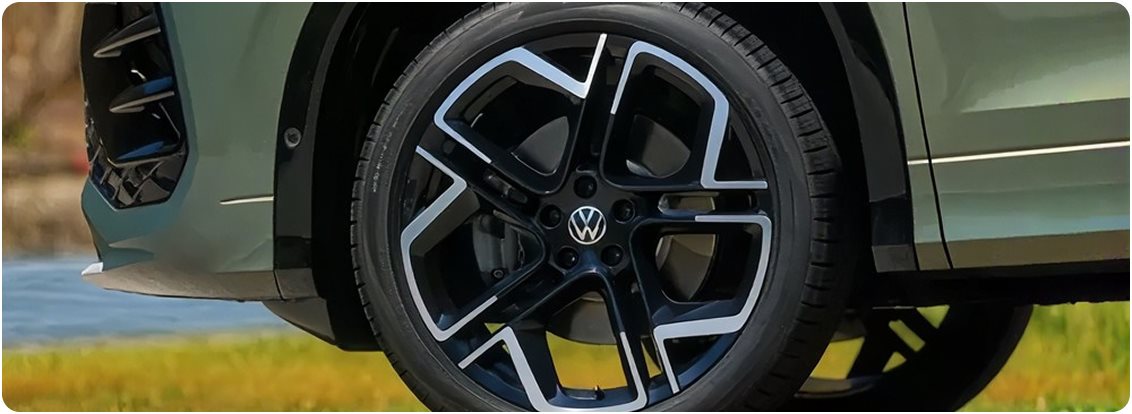 Two-tone alloy wheel on a green Volkswagen Tiguan
