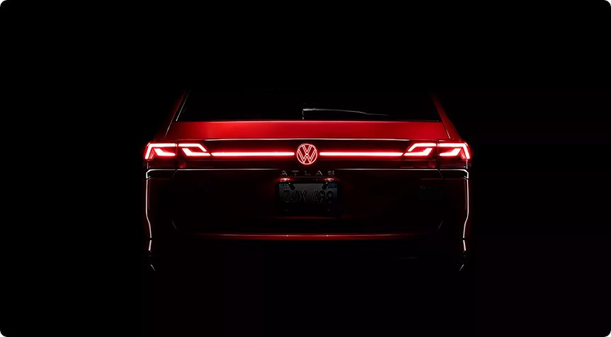 LED taillights and illuminated rear VW emblem of the Volkswagen Atlas at night
