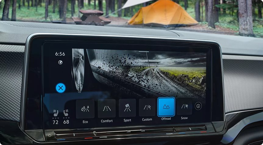 Touchscreen showing the 4MOTION Active Control drive modes with a campsite outside