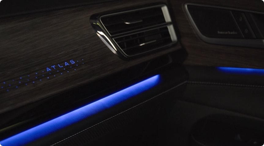 Blue ambient lighting across the Volkswagen Atlas dashboard trim