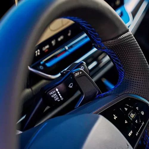 Golf R steering wheel with blue stitching and an illuminated R logo