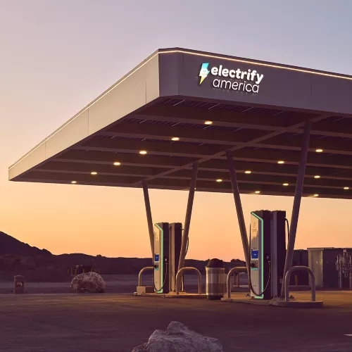 Electrify America charging station canopy at sunset
