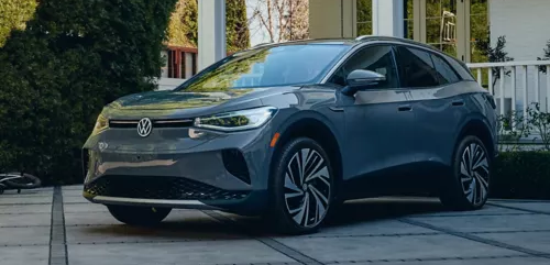 Volkswagen ID. SUV charging in front of a house