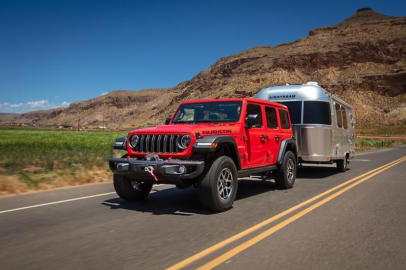 2026 Jeep Wrangler towing a heavy RV on national roads