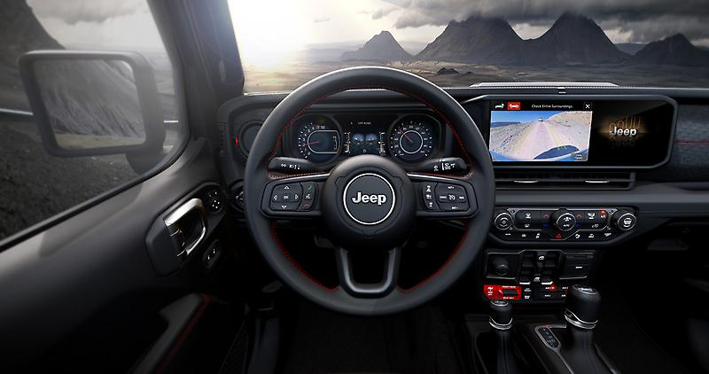 Interior dashboard of the 2026 Jeep Wrangler highlighting the Uconnect 5 12.3-inch touchscreen display