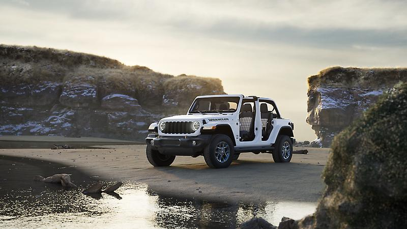 2026 Jeep Wrangler parked near rocky beach