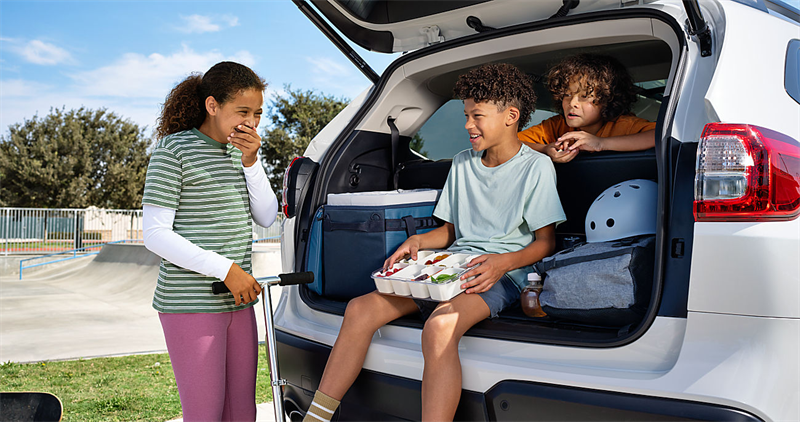 Children sitting in the cargo area of the 2027 Subaru Ascent