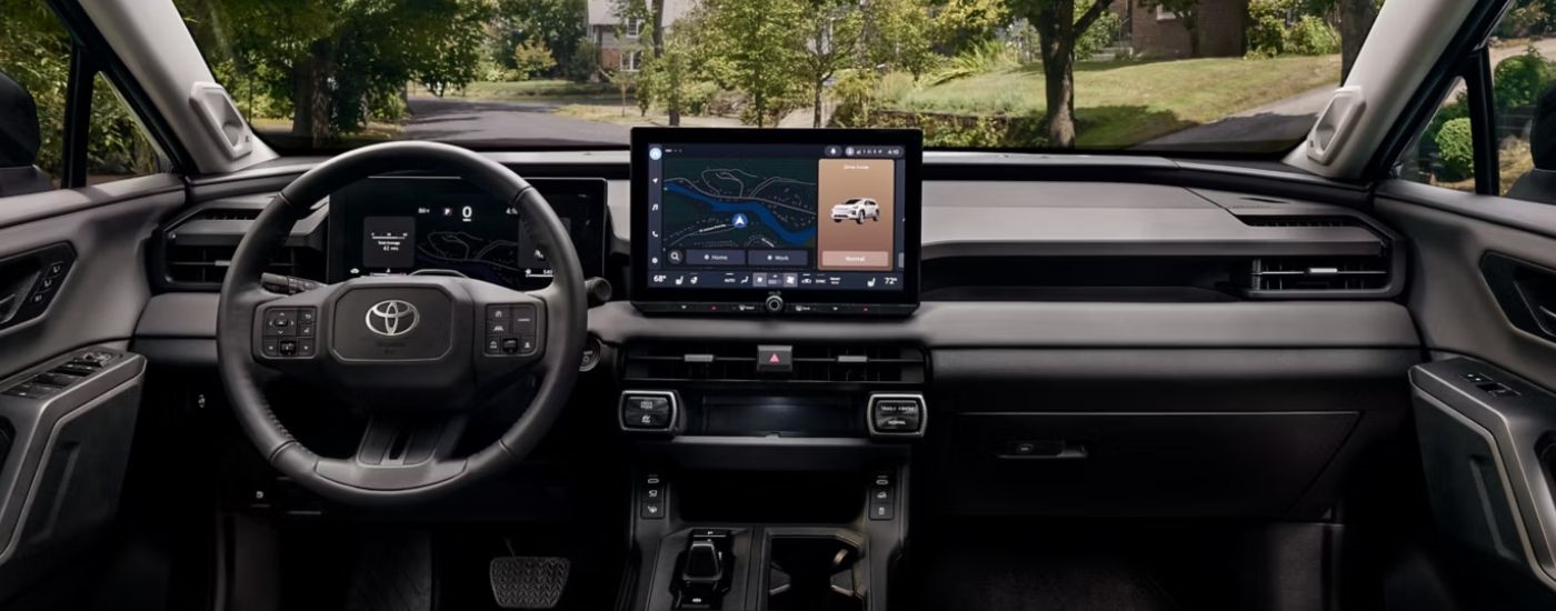 Infotainment display and steering wheel in a 2026 Toyota RAV4 Limited.