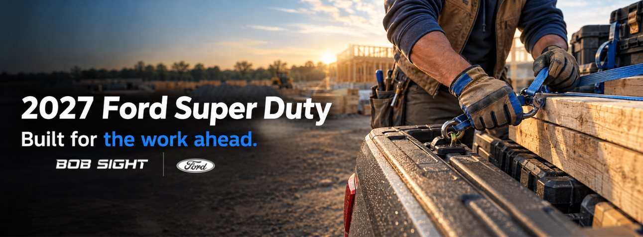 2027 Ford Super Duty F-250 and F-350 header showing a worker securing a load at a jobsite