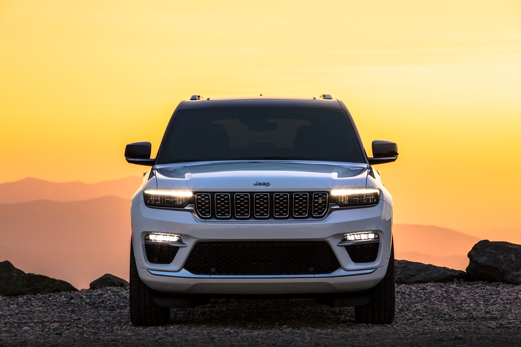 Front Facing White Jeep Grand Cherokee at sunset
