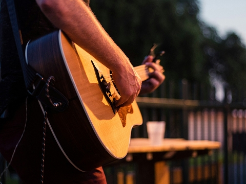a person playing the guitar on stage