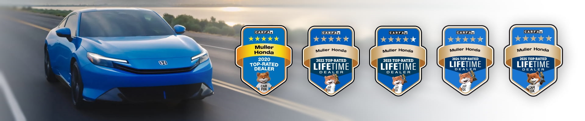 Blue vehicle driving on a coastal road alongside five CARFAX Top-Rated Dealer awards.