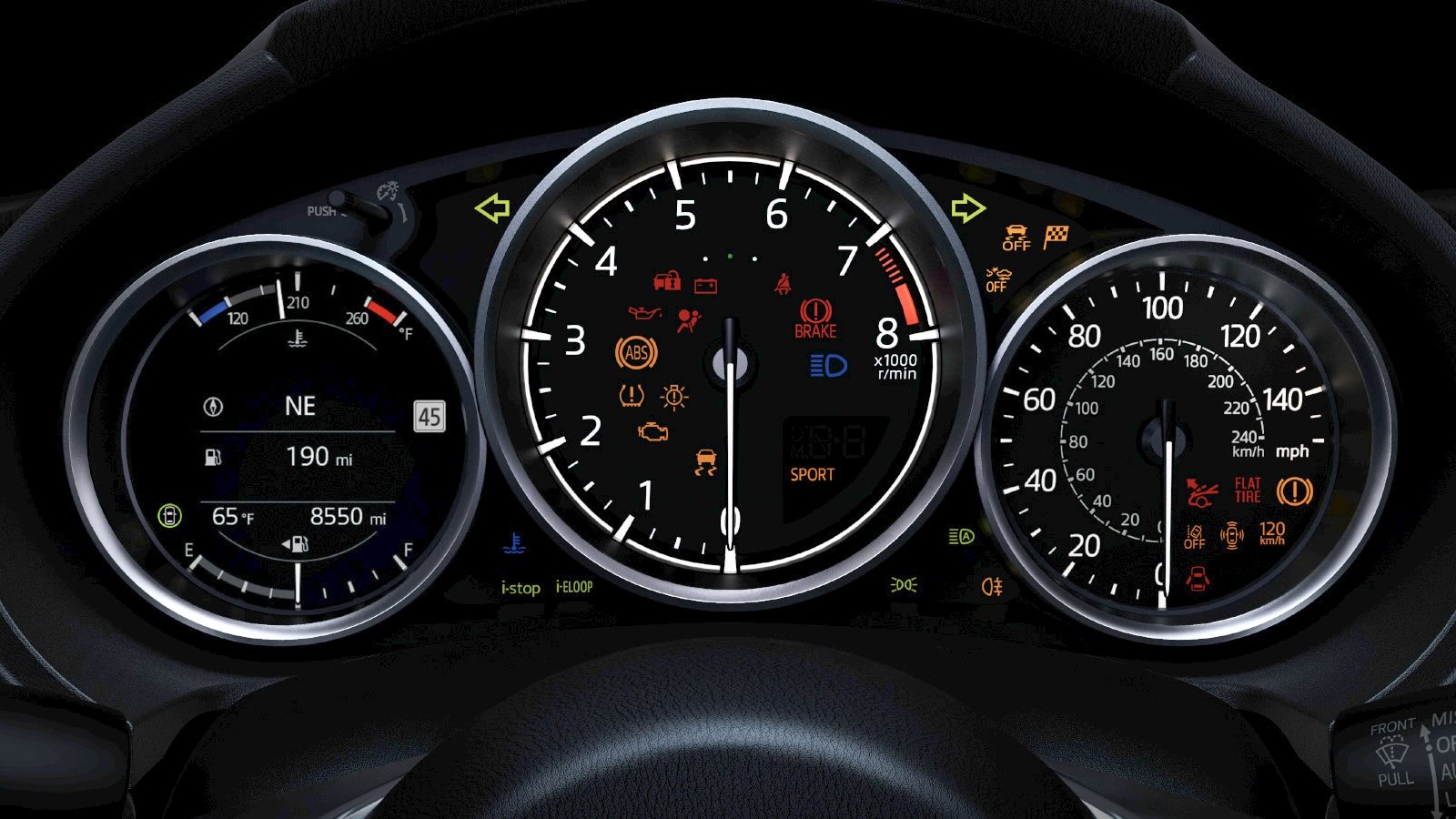 Mazda instrument cluster with the amber wrench maintenance indicator lit.