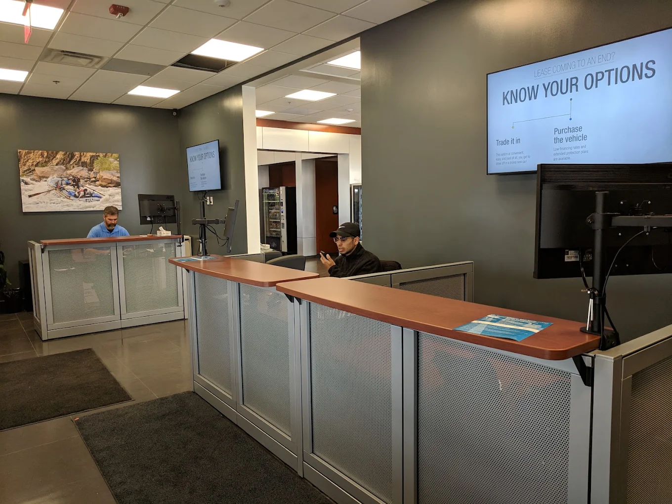 A service advisor at the service desk inside Findlay Subaru Prescott, 3230 Willow Creek Road, where each scheduled maintenance visit is written up.