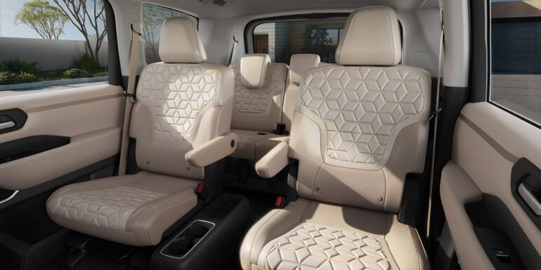 2026 Nissan Armada second-row captain’s chairs and passenger cabin.