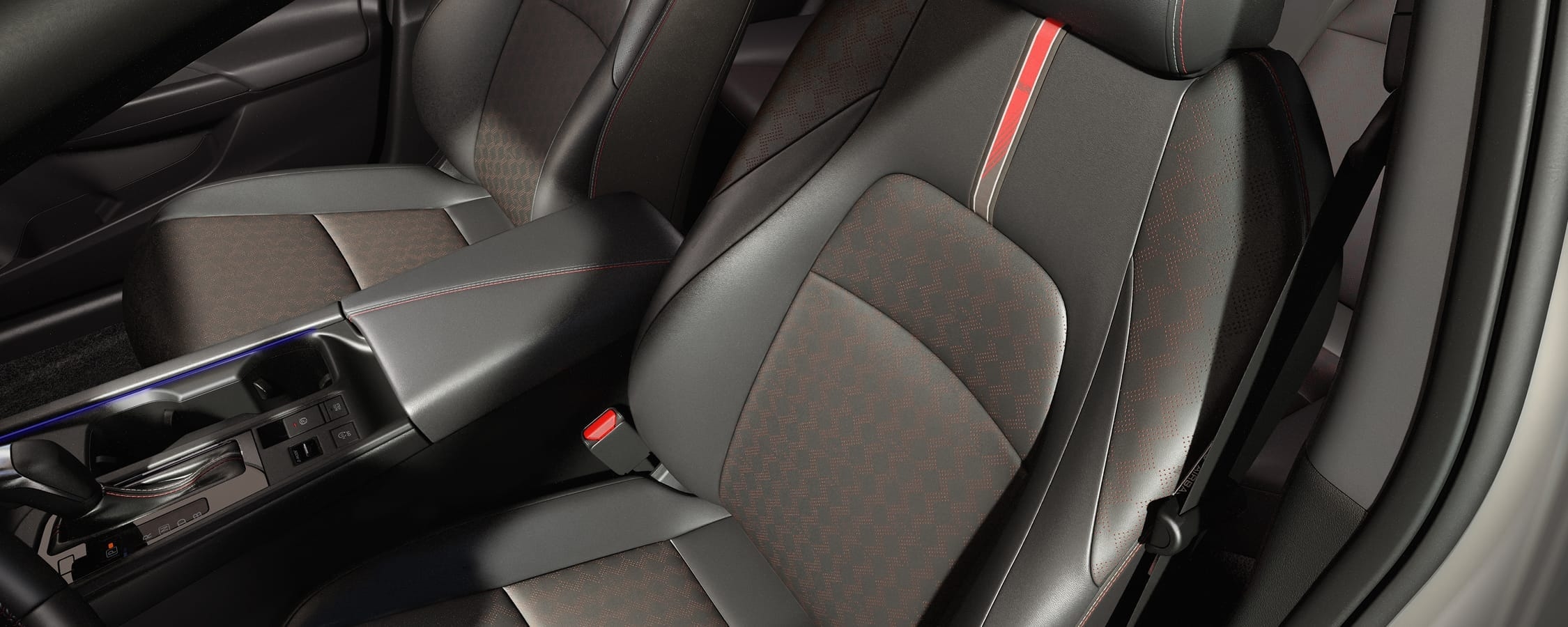 Black front seats with SR badging and center console inside the 2026 Nissan Sentra.